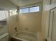 Clean bathroom with shower/tub combo and built-in shelving at 8545 Summer Vista Ave, Las Vegas, NV 89145