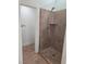 Clean bathroom with a large glass shower and tile flooring at 8545 Summer Vista Ave, Las Vegas, NV 89145