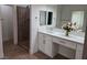 Elegant bathroom with double vanity, quartz countertop, and a glass-enclosed shower at 8545 Summer Vista Ave, Las Vegas, NV 89145