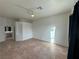 Bright bedroom featuring tile floors and a ceiling fan, with access to en-suite bathroom at 8545 Summer Vista Ave, Las Vegas, NV 89145