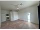Bright bedroom featuring tile floors and a ceiling fan, with access to en-suite bathroom at 8545 Summer Vista Ave, Las Vegas, NV 89145