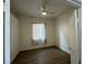 Bedroom with ceiling fan, window, and wood-look flooring at 8545 Summer Vista Ave, Las Vegas, NV 89145