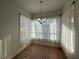 Sunlit dining area featuring bay window and chandelier at 8545 Summer Vista Ave, Las Vegas, NV 89145