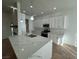Modern kitchen with white cabinets and spacious island at 8545 Summer Vista Ave, Las Vegas, NV 89145