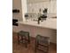 Kitchen island with seating for two and quartz countertop at 8545 Summer Vista Ave, Las Vegas, NV 89145