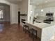 Renovated kitchen, featuring white cabinets and breakfast bar at 8545 Summer Vista Ave, Las Vegas, NV 89145