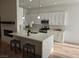 Modern kitchen with white cabinets and large island at 8545 Summer Vista Ave, Las Vegas, NV 89145