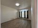 Spacious living room with large window and wood-look flooring at 8545 Summer Vista Ave, Las Vegas, NV 89145