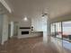 Open living room showcasing fireplace and access to patio at 8545 Summer Vista Ave, Las Vegas, NV 89145