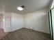 Living room featuring wood-look floors and built-in shelving at 8545 Summer Vista Ave, Las Vegas, NV 89145