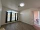 Living room with access to backyard patio and wood-look floors at 8545 Summer Vista Ave, Las Vegas, NV 89145