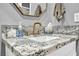 Bathroom sink area features granite counters, modern faucet, and neutral decor at 9321 January Dr, Las Vegas, NV 89134