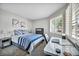 Inviting bedroom with a modern desk and a sunlit window view at 9321 January Dr, Las Vegas, NV 89134