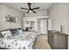 Relaxing bedroom with ceiling fan, art and mirrored closet at 9321 January Dr, Las Vegas, NV 89134
