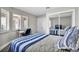 Cozy bedroom with a plush bed, mirrored closet, and a bright window at 9321 January Dr, Las Vegas, NV 89134