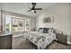 Serene bedroom with bay window, ceiling fan and calming decor at 9321 January Dr, Las Vegas, NV 89134