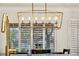 Contemporary chandelier above kitchen island with bright natural light at 9321 January Dr, Las Vegas, NV 89134