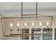 Modern chandelier with six lights illuminating the dining area at 9321 January Dr, Las Vegas, NV 89134