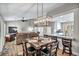 Open-concept dining room with modern lighting and hardwood floors, great for entertaining at 9321 January Dr, Las Vegas, NV 89134