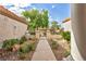 Landscaped walkway provides entrance to community area and neighboring homes at 9321 January Dr, Las Vegas, NV 89134