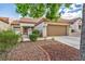 Single-story home with a two-car garage and well-manicured landscaping at 9321 January Dr, Las Vegas, NV 89134