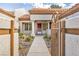Inviting front entry with walkway and wrought-iron gate at 9321 January Dr, Las Vegas, NV 89134