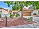 Attractive home featuring a well-kept yard, tile roof, and two-car garage at 9321 January Dr, Las Vegas, NV 89134