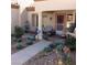 Charming front porch with seating area and decorative plants offers inviting curb appeal at 9321 January Dr, Las Vegas, NV 89134