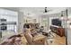 Spacious living room with comfortable seating, a ceiling fan, and modern decor at 9321 January Dr, Las Vegas, NV 89134