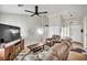 Comfortable living room featuring a ceiling fan, plush seating, and stylish decor at 9321 January Dr, Las Vegas, NV 89134