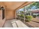 Screened-in patio offers a relaxing view of the lush landscaping and serene outdoors at 9321 January Dr, Las Vegas, NV 89134
