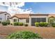 Rear exterior showcasing low-maintenance landscaping and a covered patio area at 9321 January Dr, Las Vegas, NV 89134