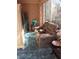 Inviting sunroom with comfortable seating, storage, and blue patterned rug at 9321 January Dr, Las Vegas, NV 89134