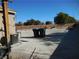 Large backyard with gravel, trash cans, and some yard tools at , North Las Vegas, NV 89031