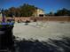 Backyard with gravel, trash cans, and some yard tools at , North Las Vegas, NV 89031