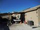 Covered patio with table and AC unit in the backyard at , North Las Vegas, NV 89031