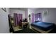 Spacious bedroom with a desk and blue bedding at , North Las Vegas, NV 89031