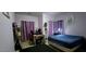 Bright bedroom featuring a large bed, purple curtains, and ample natural light at , North Las Vegas, NV 89031