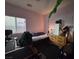 Bedroom with a large window, neutral walls, and lots of personal touches at , North Las Vegas, NV 89031