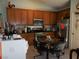 Eat-in kitchen with wood cabinets, stainless steel appliances, and a breakfast table at , North Las Vegas, NV 89031