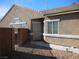 Side view of house with light tan exterior and security door at , North Las Vegas, NV 89031