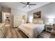 Main bedroom with ceiling fan and large window at 10487 Tyler Park Ave, Las Vegas, NV 89135