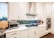 White kitchen with stainless steel appliances and built in oven at 140 Springbough Ln, Las Vegas, NV 89138