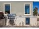 Outdoor kitchen with grill, pizza oven, and mini fridge at 140 Springbough Ln, Las Vegas, NV 89138