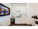 Modern wet bar with wine cooler and espresso machine at 140 Springbough Ln, Las Vegas, NV 89138