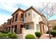 Two-story townhome with Spanish-style architecture, featuring a landscaped front yard at 1525 Spiced Wine Ave # 13101, Henderson, NV 89074