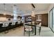 Modern kitchen with a large island, stainless steel appliances and dining area at 2631 Mystere Ct, Las Vegas, NV 89117