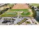 Aerial view of the golf course with driving range and putting green at 2820 Lotus Hill Dr, Las Vegas, NV 89134