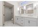 Modern bathroom with double vanity and walk-in shower at 2820 Lotus Hill Dr, Las Vegas, NV 89134