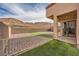 Landscaped backyard with artificial turf and gravel at 284 Crimson Edge St, Henderson, NV 89012